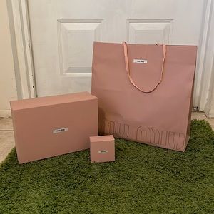 Miu Miu Bundle of boxes and shopping bag